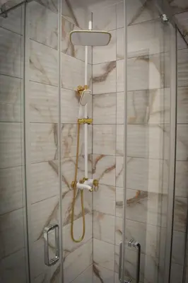a shower with a glass door in a bathroom at Apartman PLAN B in Banja Luka