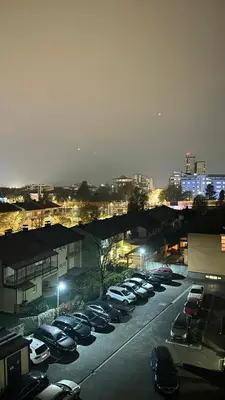 a parking lot filled with cars at night at Apartman River - stan na dan Gradiška in Bosanska Gradiška