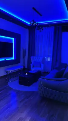 a living room with blue lights and a couch at Spa stan na dan in Banja Luka