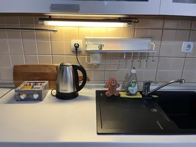 a kitchen counter top with a sink and a counter top at Apartman KIKA in Banja Luka
