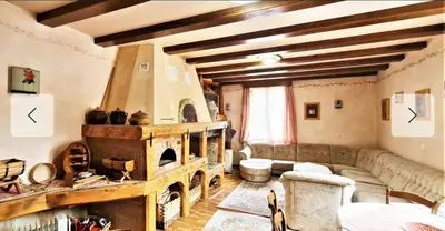 a living room with a couch and a fireplace at Sindbad Vlašić in Vlasic