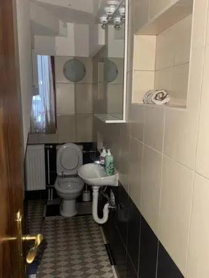 a small bathroom with a toilet and a sink at Sindbad Vlašić in Vlasic