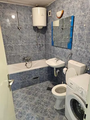 a bathroom with a toilet and a sink at Apartman Nova Varos in Banja Luka
