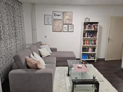 a living room with a couch and a table at Apartman Nova Varos in Banja Luka