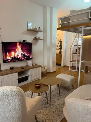 a living room with a flat screen tv on a wall at Perfetto e Splendido! in Banja Luka