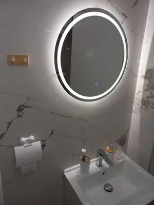a bathroom with a sink and a mirror on the wall at Perfetto e Splendido! in Banja Luka