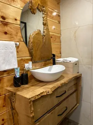 a bathroom with a bowl sink and a mirror at Vikendica ANA in Šipovo