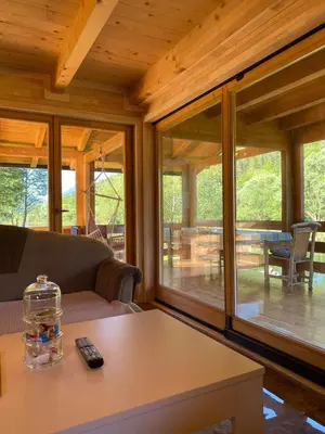 a living room with a couch and a table at Vikendica ANA in Šipovo