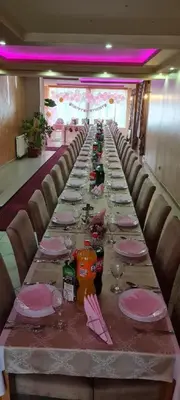 a long table with plates and glasses on it at Genex-M in Bugojno