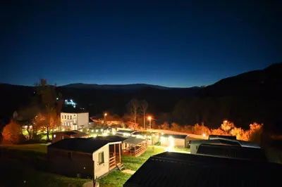 a view of a town at night with lights at Ćuranov rep in Mrkonjić Grad