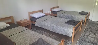 a room with three beds in a room at Tamara in Drvar