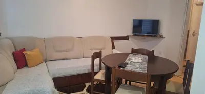 a living room with a couch and a table at Tamara in Drvar