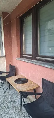 a table and chairs sitting outside of a building at Tamara in Drvar
