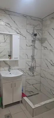 a bathroom with a shower and a sink at Tamara in Drvar