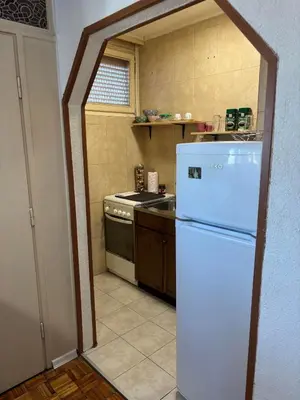 a kitchen with a white refrigerator and a stove at Apartment Banja Luka in Banja Luka
