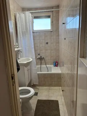 a bathroom with a tub and a toilet and a sink at Apartment Banja Luka in Banja Luka