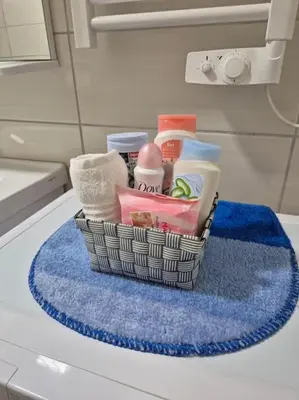 a basket of toiletries sitting on top of a counter at Studio Apartment Borik 19 in Banja Luka