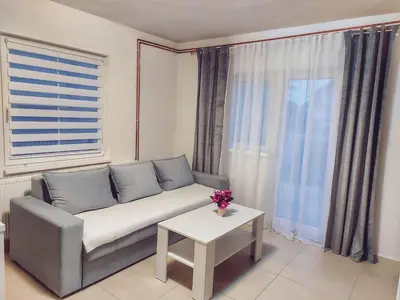 a living room with a couch and a table at Stan na dan Gabriella in Prijedor