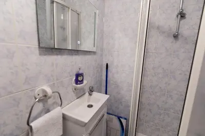 a bathroom with a toilet and a sink and a mirror at Tanja in Banja Luka
