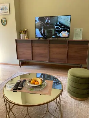 a living room with a tv and a coffee table at Lux Palata in Banja Luka