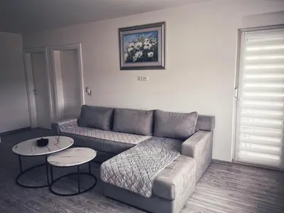 a living room with a couch and a table at Apartman Luxe in Livno