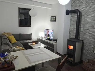 a living room with a wood stove in a room at Sweet Home Vlasic in Vlasic