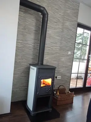 a stove in a room with a brick wall at Sweet Home Vlasic in Vlasic