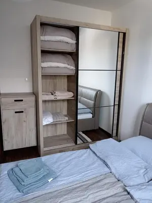 a bedroom with a mirror next to a bed at Sweet Home Vlasic in Vlasic