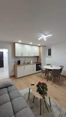 a living room with a couch and a table at Bella Vacanza Apartment in Banja Luka