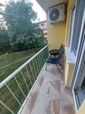 a balcony with a table and a fan at Index 1 in Hiseti