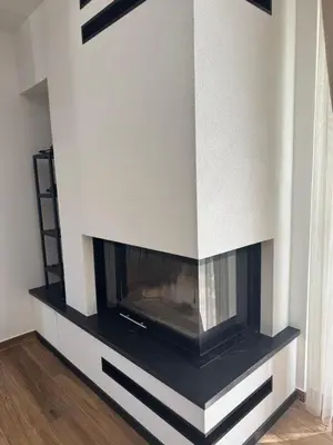 a fireplace built into a wall with a tv at Country House Lištani-renta quad in Livno