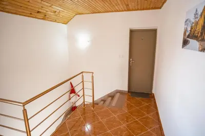 a staircase in a room with a stair case at Apartman Biser Kupresa 3 in Kupres