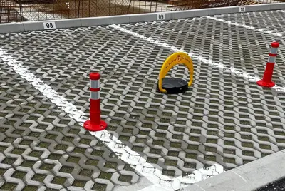 a construction area with two orange cones and a yellow object at Apartman Sofija Banja Luka in Banja Luka