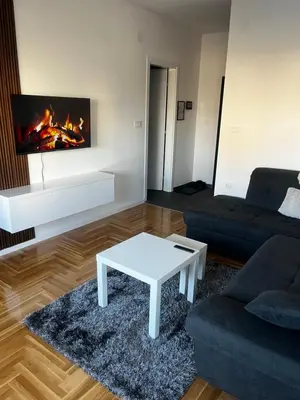 a living room with a couch and a coffee table at Apartman Sofija Banja Luka in Banja Luka