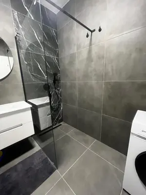 a bathroom with a shower with a glass door at Apartman Sofija Banja Luka in Banja Luka
