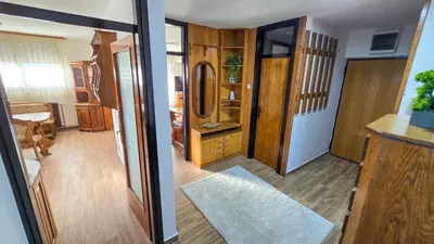 a hallway of a house with a door open at Center Heritage Apartment in Teslić