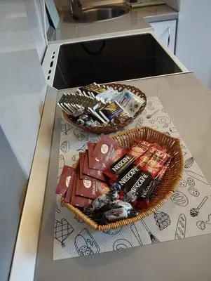 a basket of food on a counter in a kitchen at Apartman Dunja Doboj in Doboj
