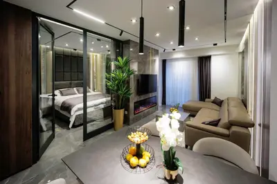 a living room with a couch and a bed at Luxury Apartments Palata - Stan Infinity in Banja Luka