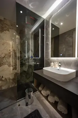 a bathroom with a sink and a mirror at Luxury Apartments Palata - Stan Infinity in Banja Luka