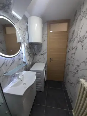 a bathroom with a sink and a mirror at stan san banjaluka in Banja Luka