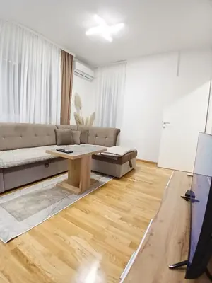 a living room with a couch and a table at Silencio in Banja Luka