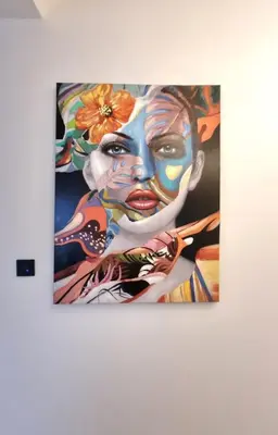 a painting of a woman on a wall at Kuća za odmor 