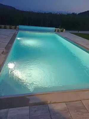 a large swimming pool with blue water at Kuća za odmor 