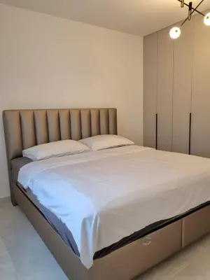 a bedroom with a large bed with white sheets at Kuća za odmor 