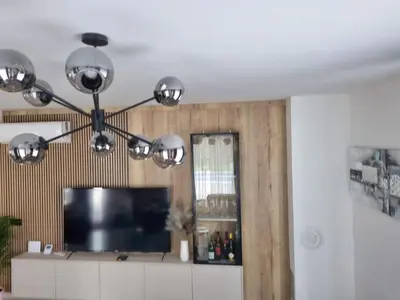 a room with a flat screen tv and a television at Kuća za odmor 