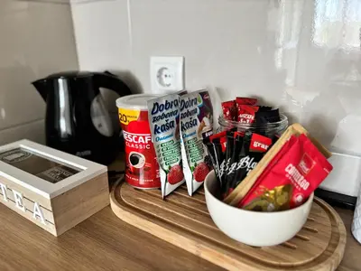 a table with a bowl of food and a bowl of snacks at Apartman Leo in Banja Luka