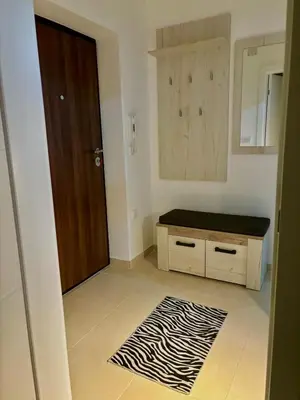 a room with a door and a zebra print rug at Apartman Leo in Banja Luka