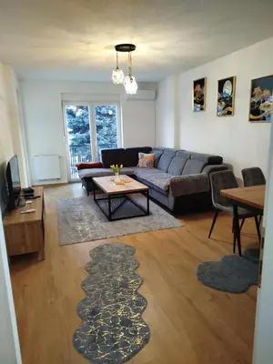 a living room with a couch and a table at Apartman Munir Zahirovič in Travnik