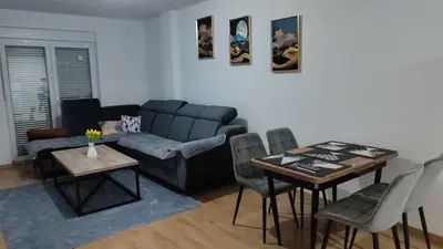 a living room with a couch and a table at Apartman Munir Zahirovič in Travnik
