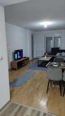 a living room with a couch and a tv at Apartman Munir Zahirovič in Travnik